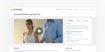 Two people performing the External Rotation Lag Sign Test; one assists while the other sits upright.