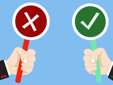 Illustration of hands holding signs with a red "X" and a green checkmark on a blue background.