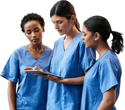 Three healthcare professionals in blue scrubs review a tablet at Medbridge.