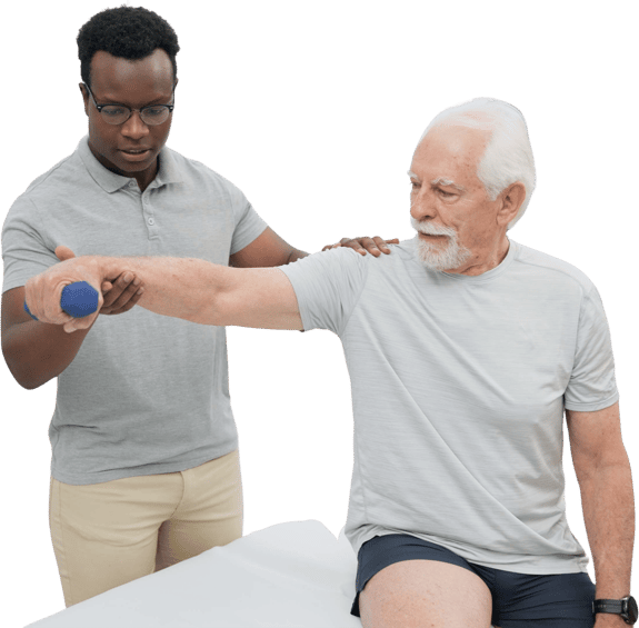 An older man lifts a dumbbell with assistance.