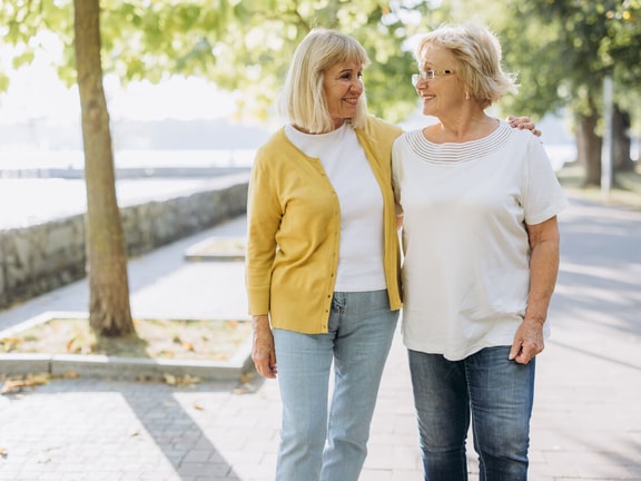 2 senior women walking together - elderly mobility scale