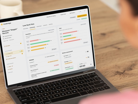 Clinician reviewing patient-reported outcomes data in the Medbridge platform to support MIPS quality reporting.
