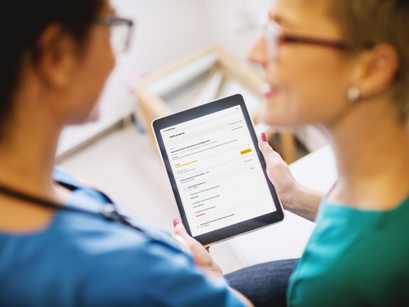 Clinicians reviewing CHAP-verified Medbridge Skills on a tablet.