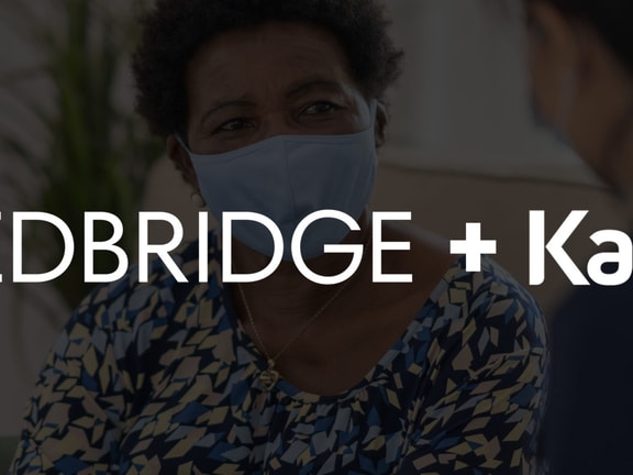 Two people sit and talk, with Medbridge and KanTime Healthcare Software logos overlaid.
