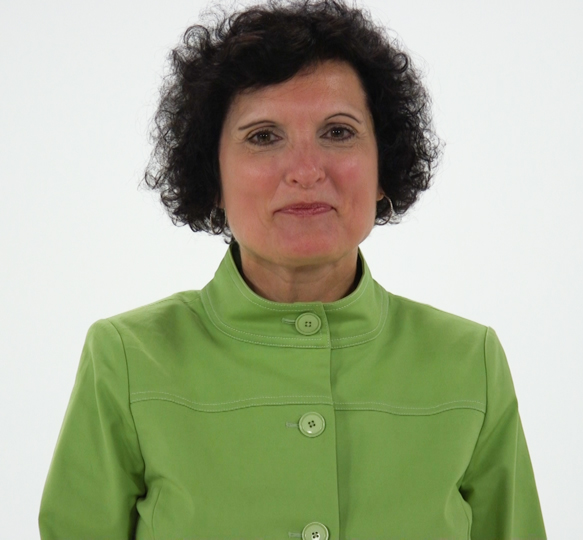 A woman with short curly hair in a green jacket represents modern digital healthcare, against a plain white background, for medbridge.