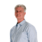 Gray-haired man in a light blue shirt on a plain background for medbridge.