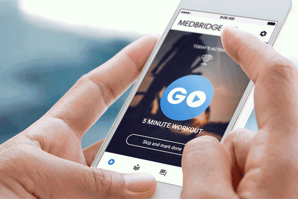 A smartphone user interacts with medbridge, displaying a play button for a 5-minute workout.