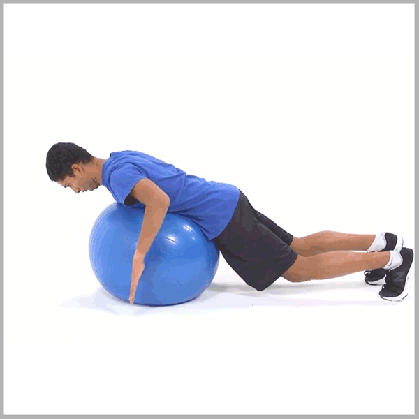 A person in a blue shirt and black shorts exercises on a blue stability ball with arms and legs extended.