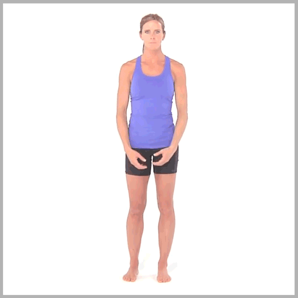 A person in athletic wear demonstrates a squat exercise on Medbridge.