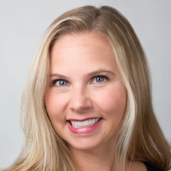 Smiling person with long blonde hair and blue eyes, featured on medbridge.