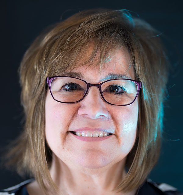 A smiling person represents medbridge's future of digital healthcare against a dark background.