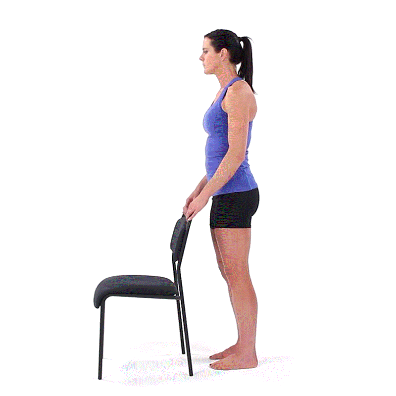 A person in a blue tank top and black shorts performs squats holding a chair for balance during Medbridge healthcare training.